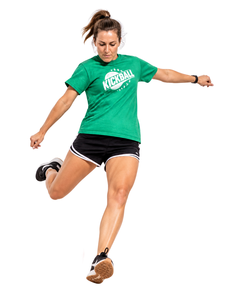 Kickball player mid-kick striking a rubber ball